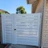White aluminum horizontal slat semi-privacy double gate with 6 inch slats, modern curb appeal design, durable and low-maintenance finish